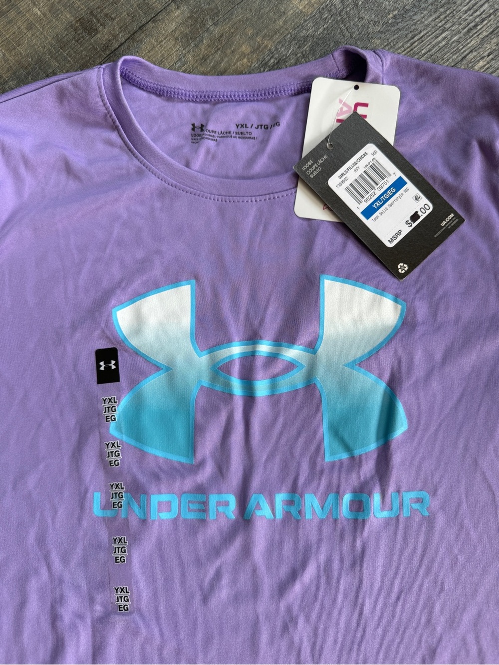 Kid’s XL Under Armour Purple Tee with Aqua/ blue and White Logo.  NWT.